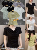 Women's modal cowl neck draped fitted top in 6 colours — black, dark navy, light purple, mint green, lemon yellow and white — on hangers and modelled