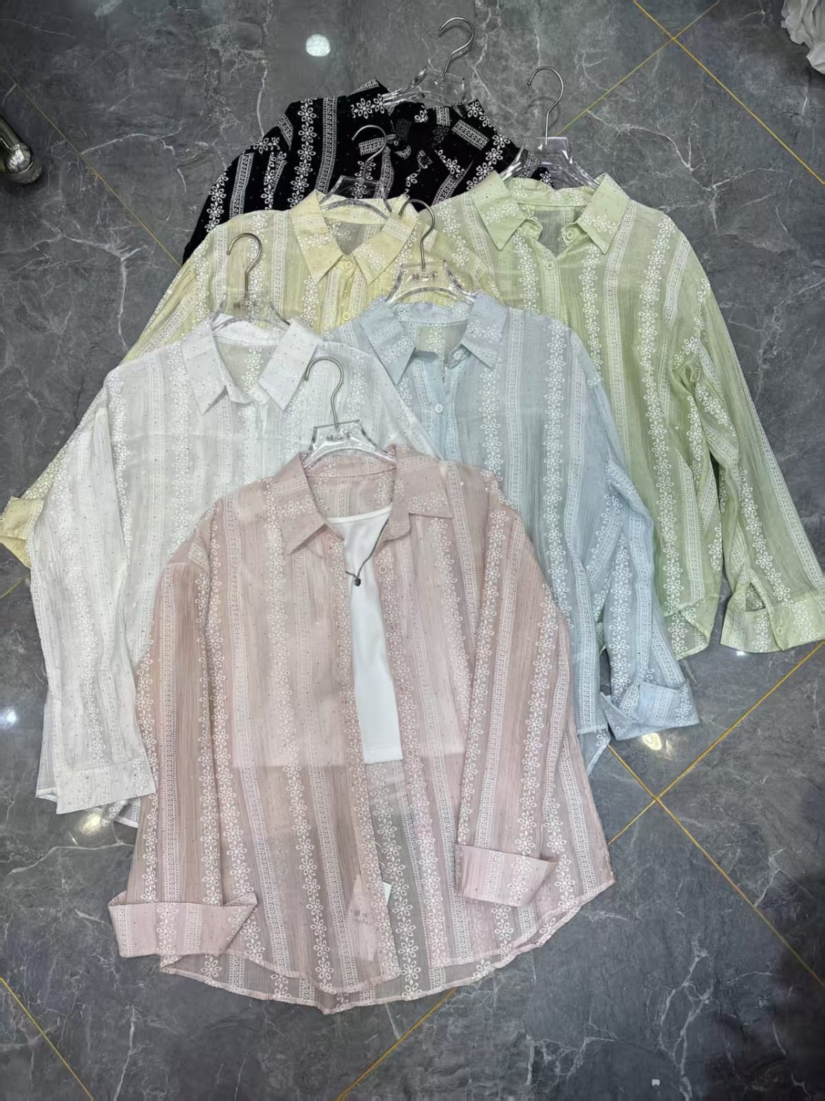 Women's floral embroidered stripe shirt in 5 colours — black, ivory, sage green, sky blue and blush pink — displayed on hangers