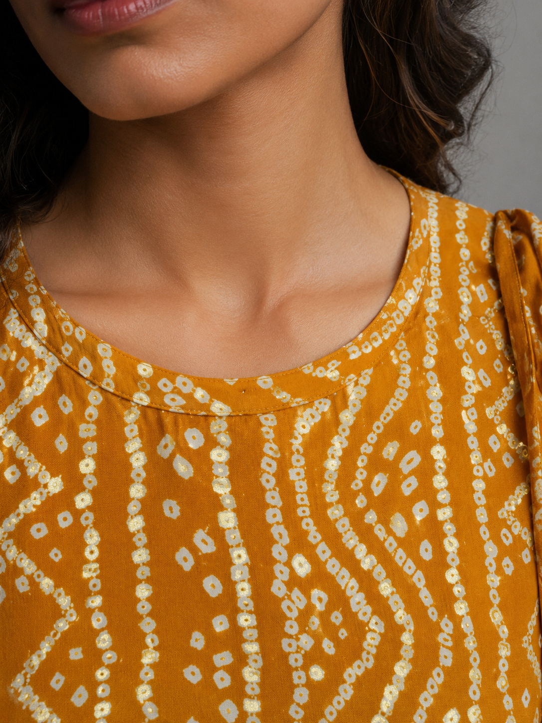 Mustard Bandhani Print Sleeveless Peplum Top | Tie-Detail Ethnic Fusion Top for Women | Miss Kapachi
