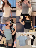 Women's fitted scoop-neck short-sleeve top with rhinestone-style chest detail in blue, grey, white and black
