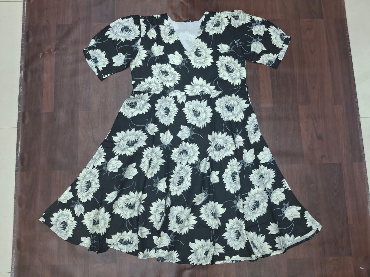 Women's V-neck short sleeve sunflower print fit-and-flare skater midi dress in black by Zero+1