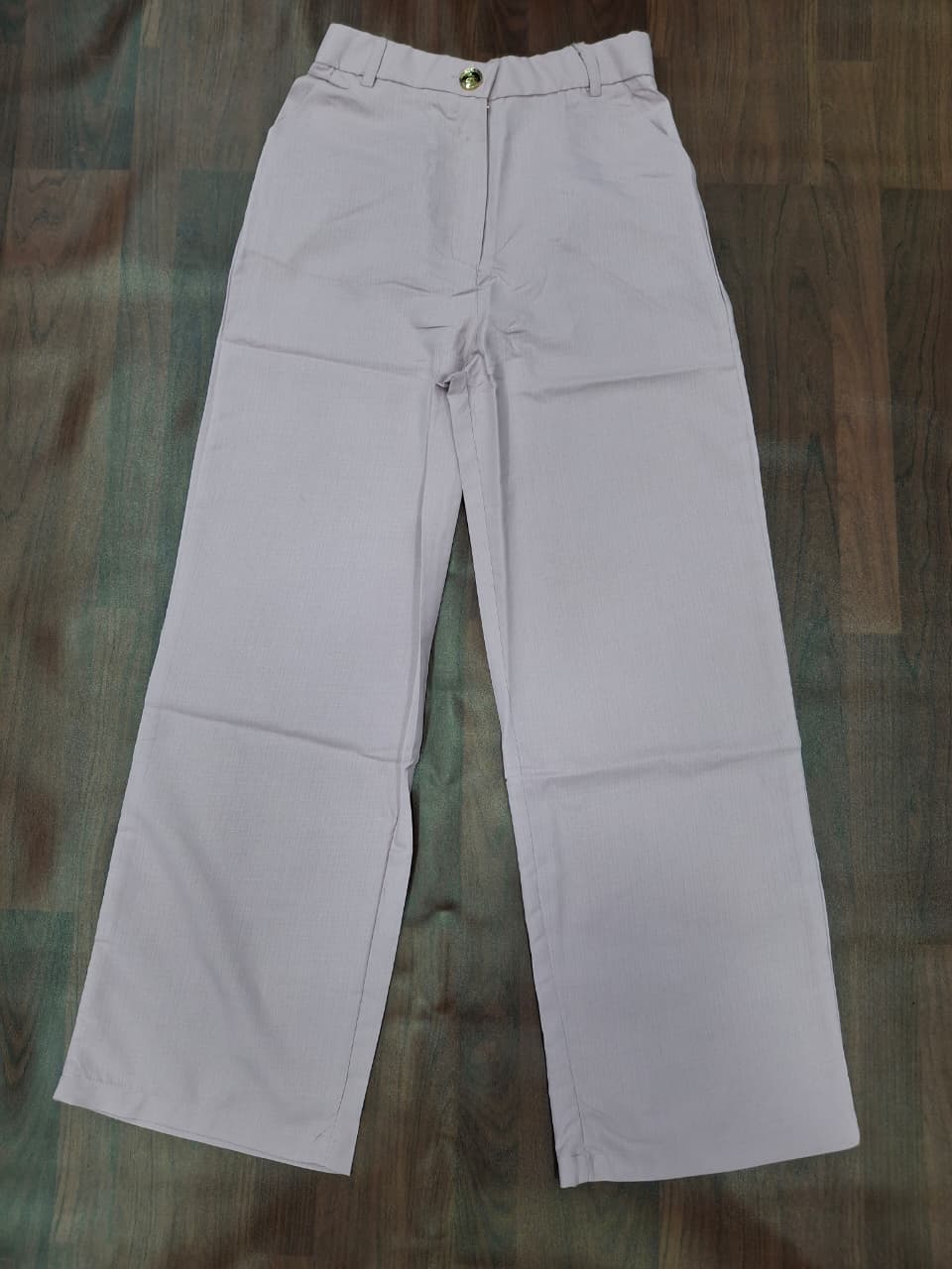 Women's high-waist wide-leg palazzo pants in lavender with gold button detail by Miss Kapachi