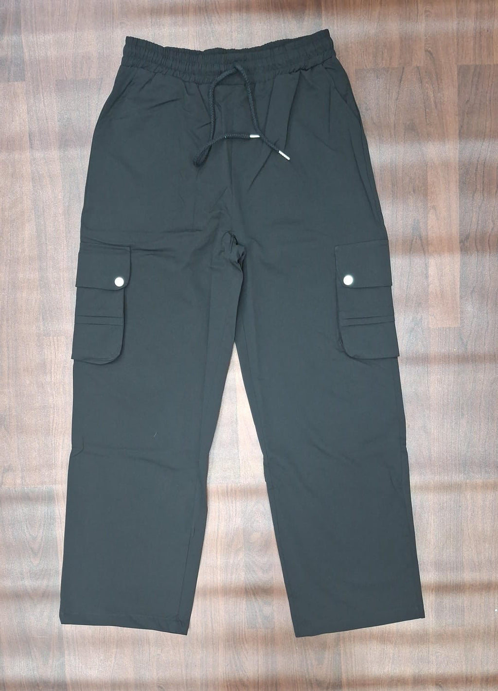 Pale blue-grey relaxed-fit cargo pants with drawstring waist and flap cargo pockets