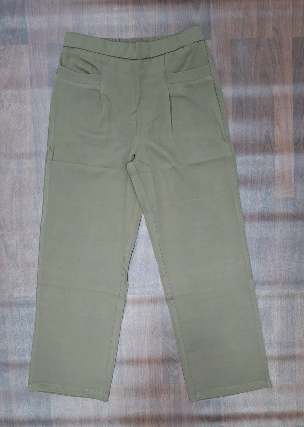 Charcoal trousers showing waistband and front pockets