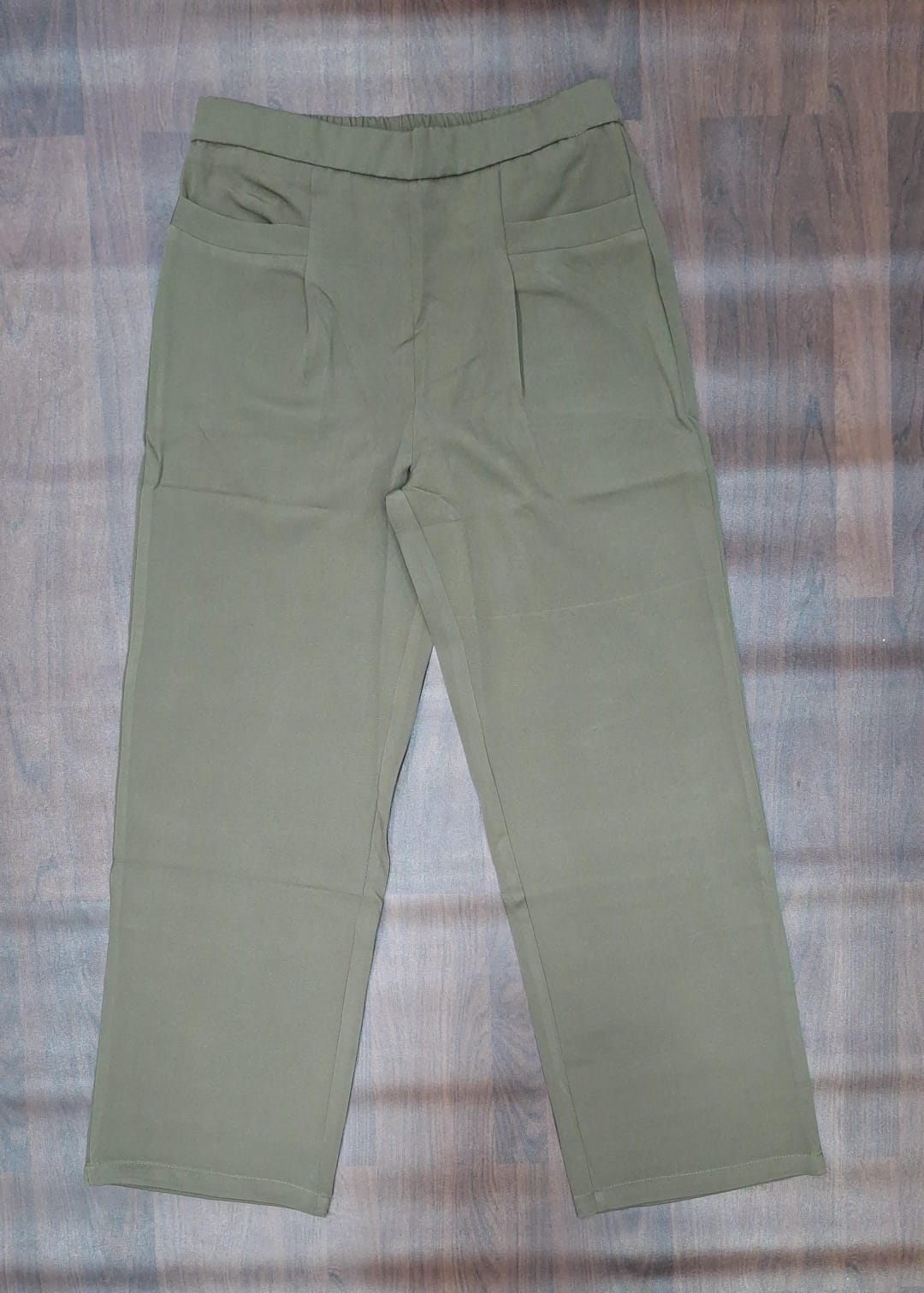 Charcoal trousers showing waistband and front pockets