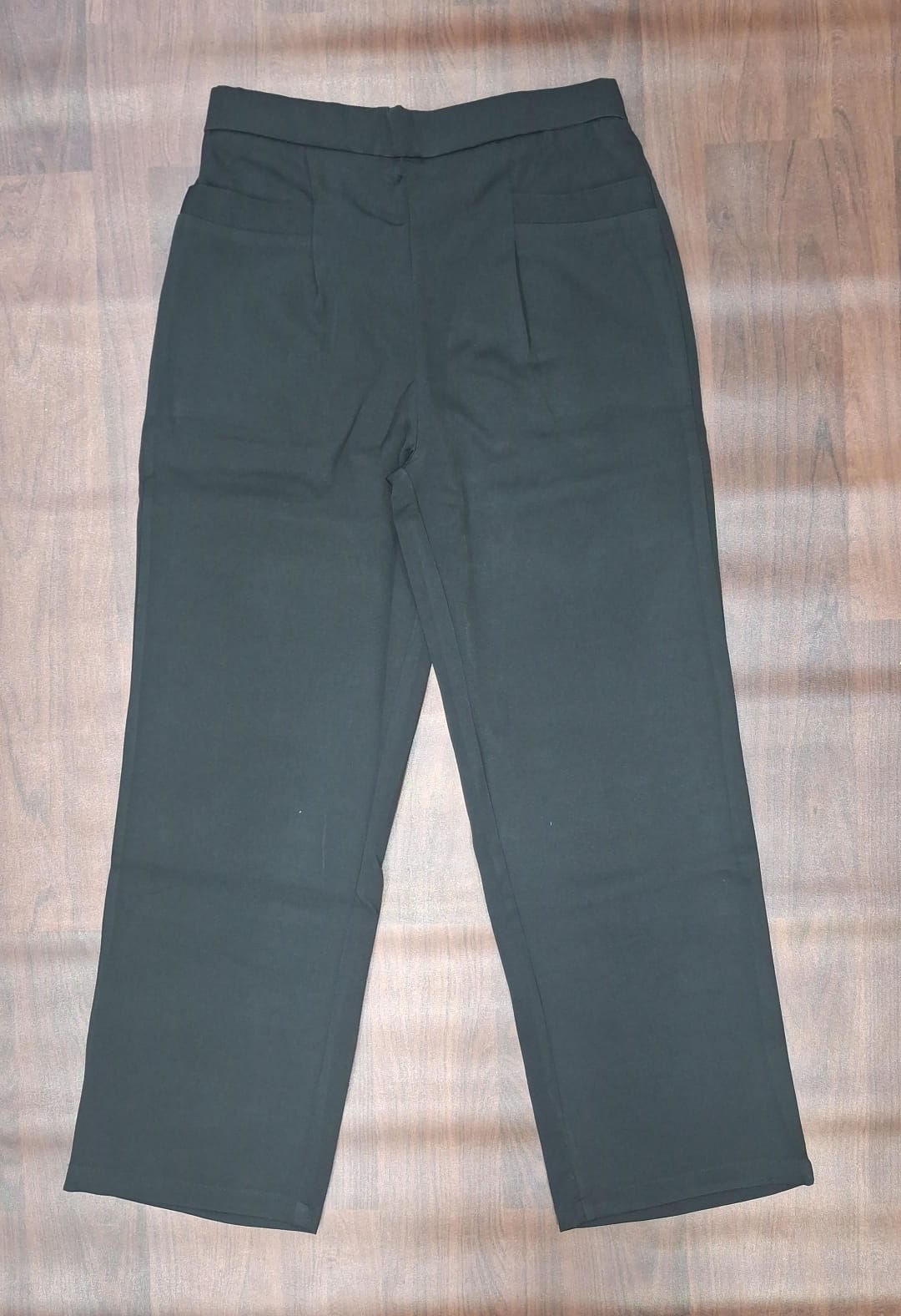 Beige trousers showing waistband and front pockets