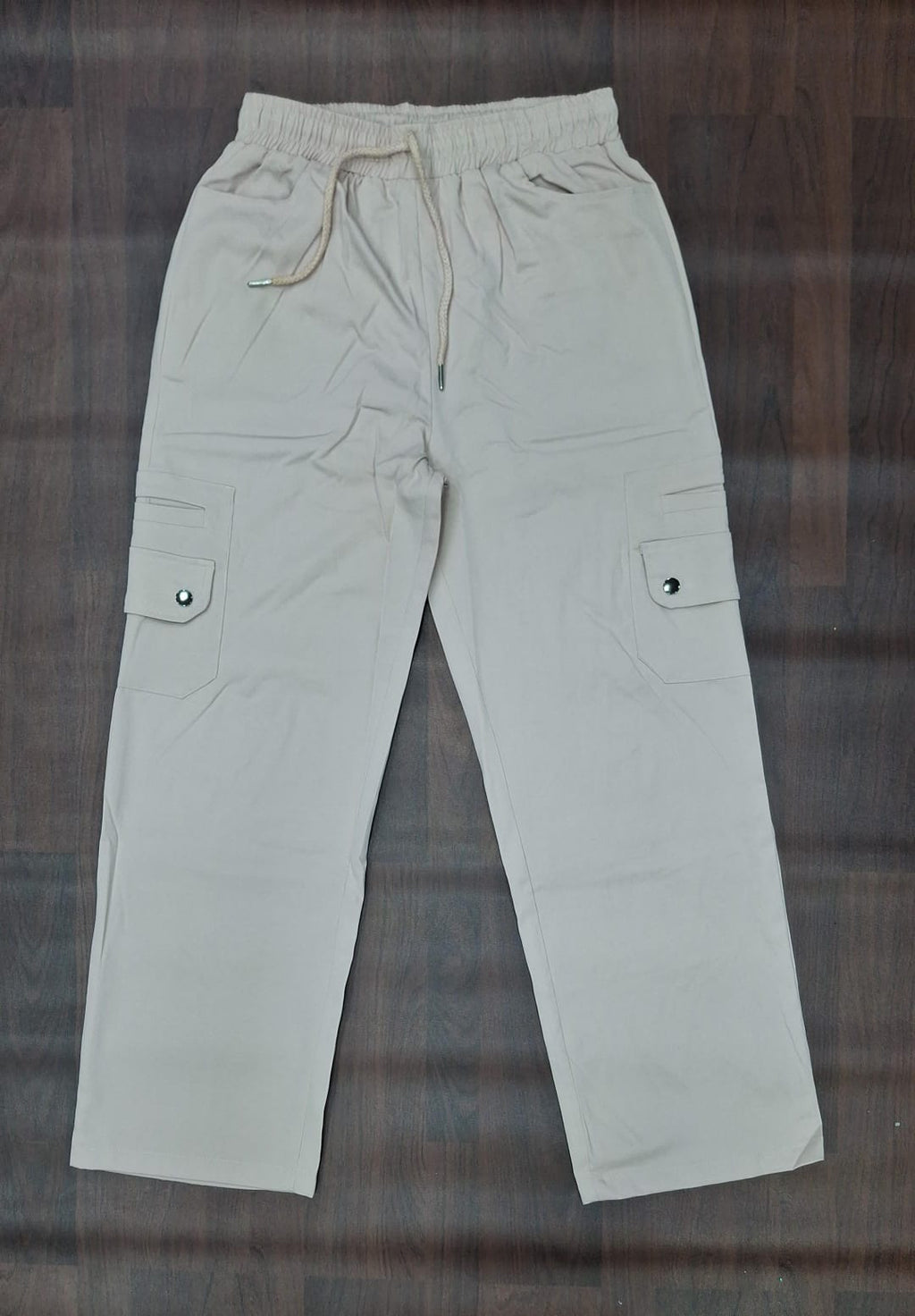 Black cargo pants with drawstring waist and functional cargo pockets