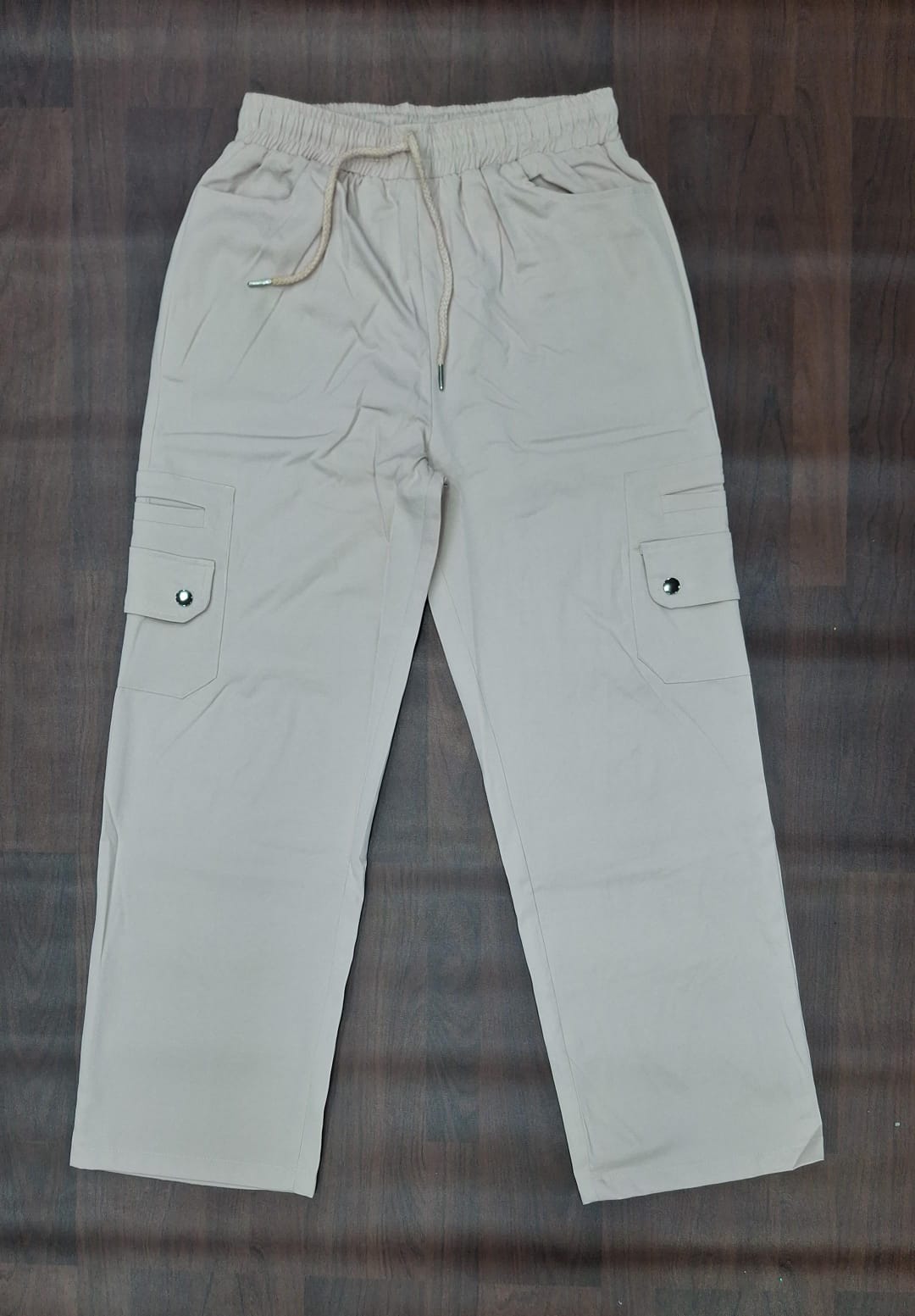 Black cargo pants with drawstring waist and functional cargo pockets