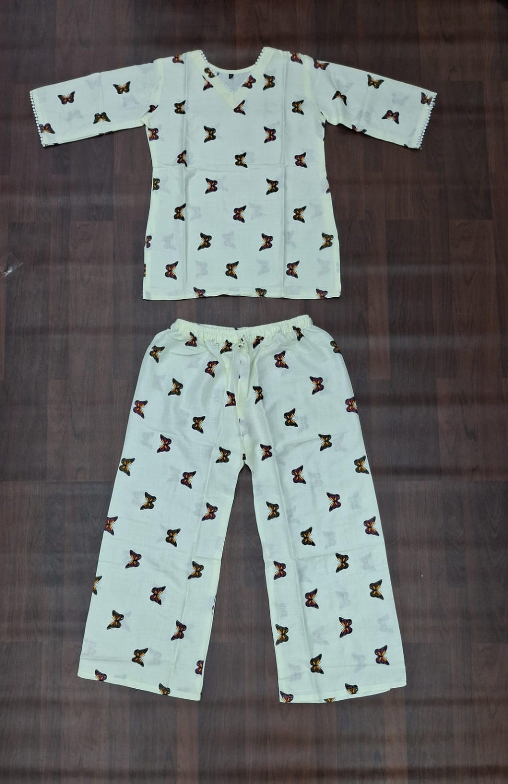 Butterfly print lounge set showing matching top and straight-leg pants