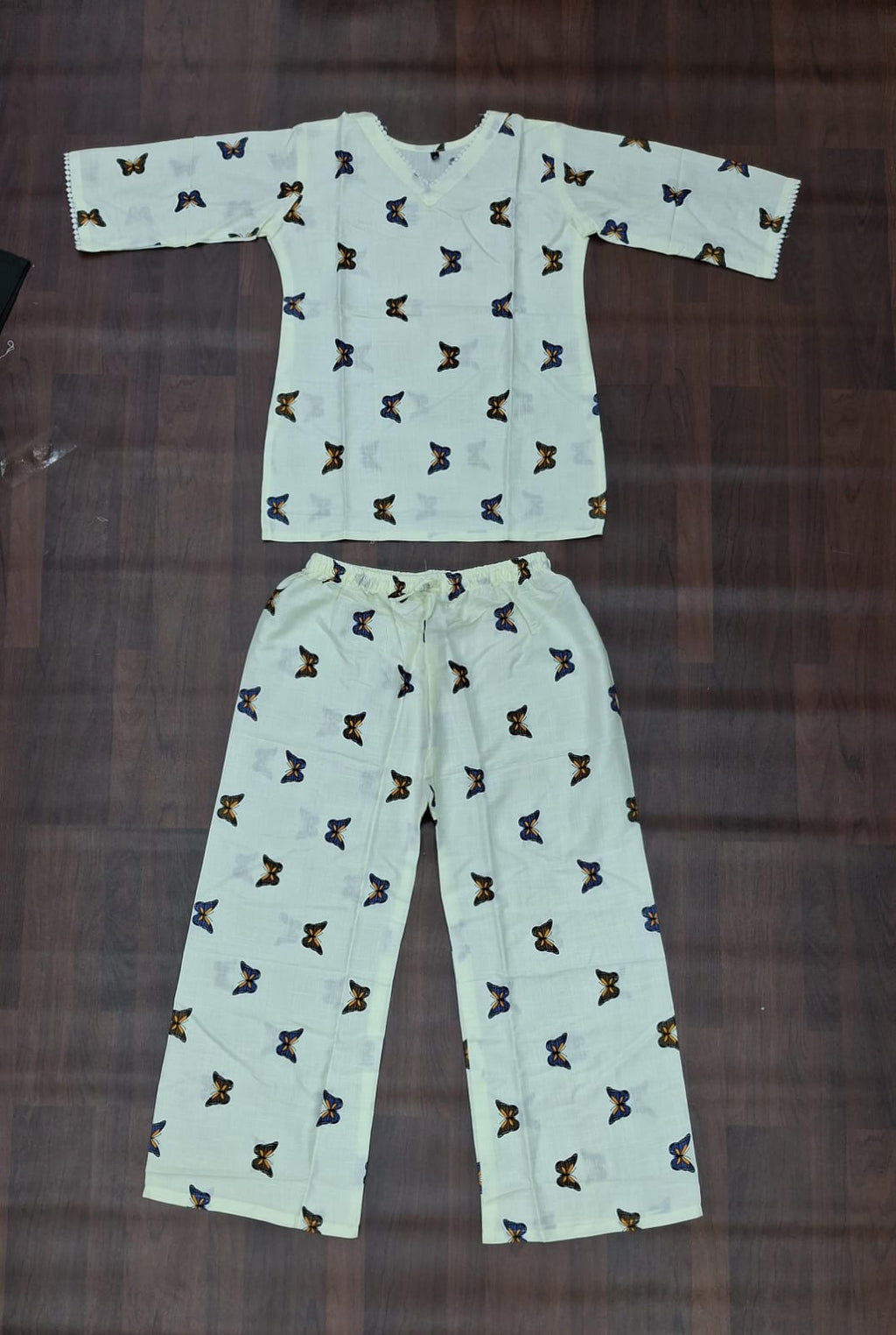 Matching butterfly print top and pants set in a pale mint colourway