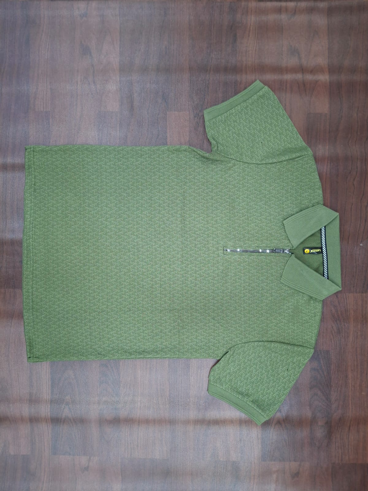 Black textured half-sleeve zip polo shirt with stand collar and front half-zip