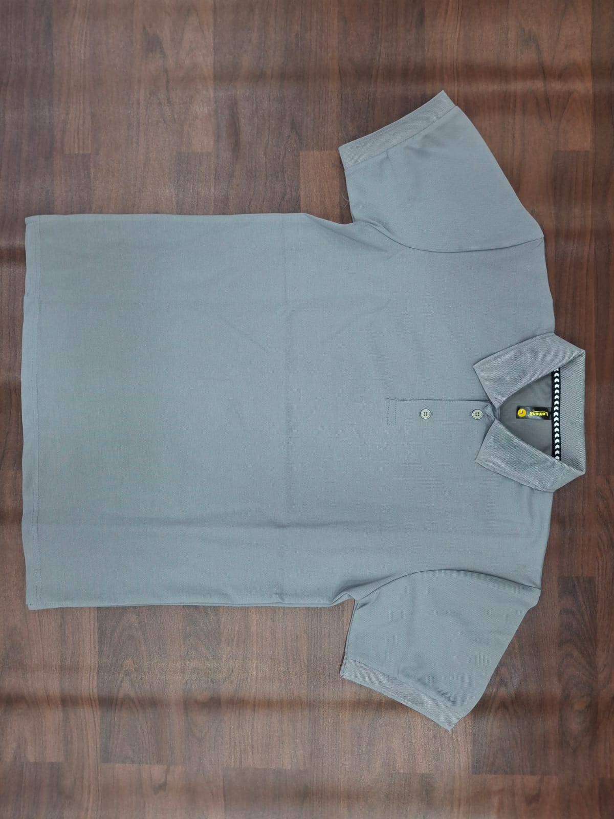 Beige solid half-sleeve polo T-shirt with structured collar, two-button placket, and contrast trim